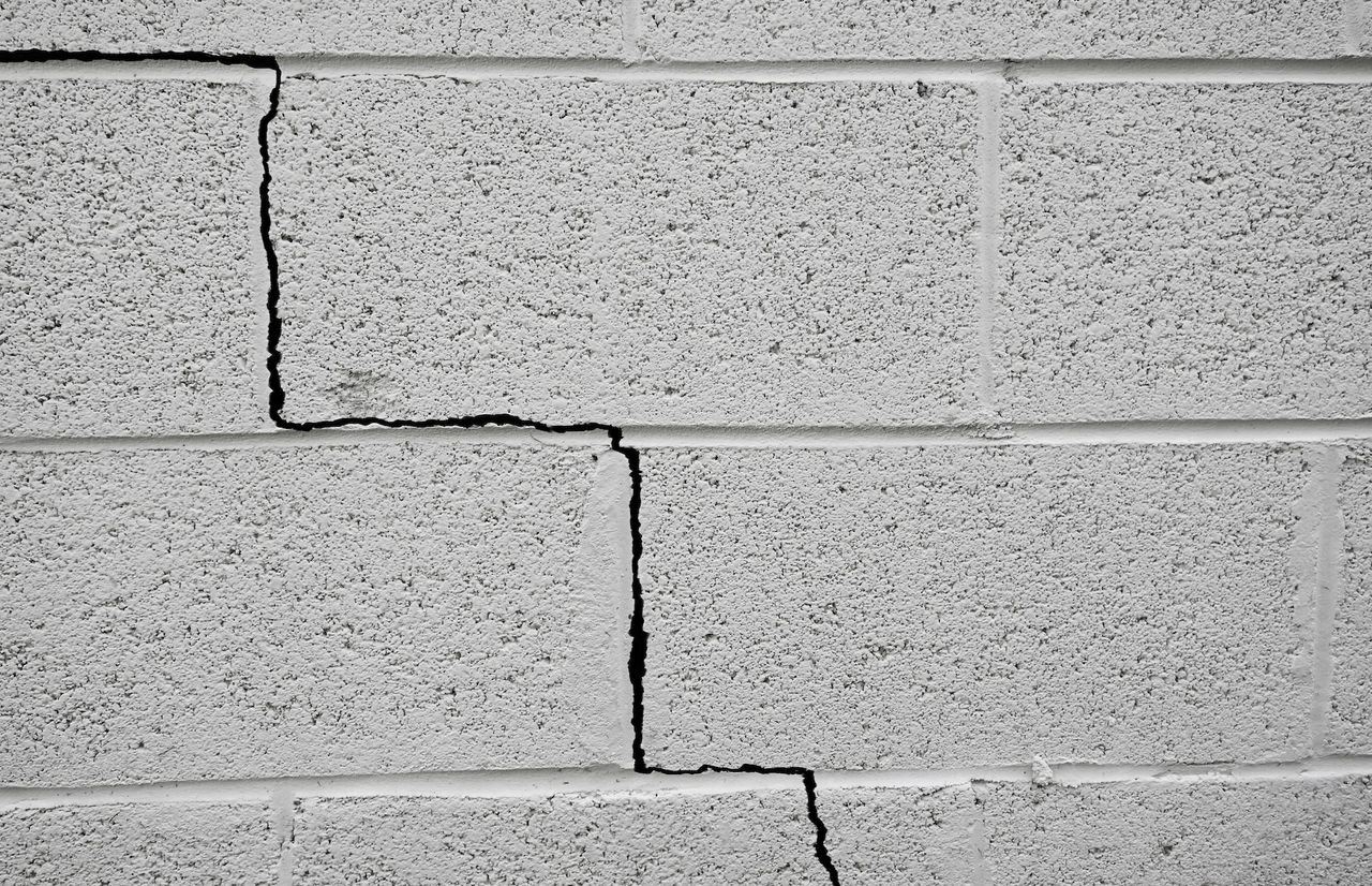 Crack in a cinder block building foundation                               